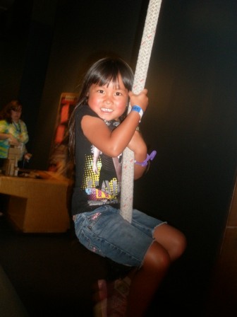 Kasen swinging on a rope at Science Center
